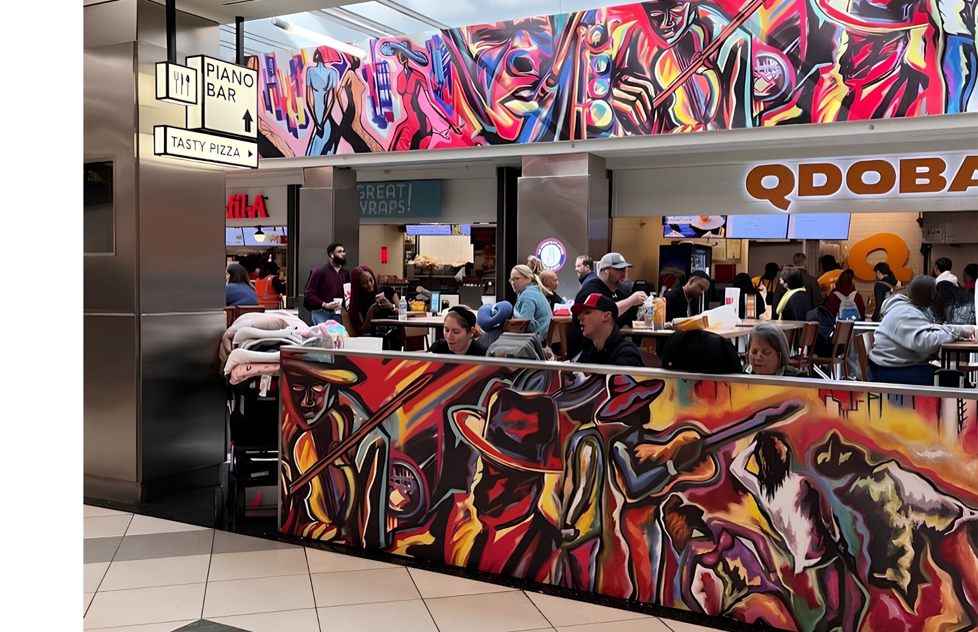 Corey Barksdale's combined mural artwork spanning the Concourse A food court at Hartsfield-Jackson Atlanta International Airport, above the dining area near Qdoba and Chick-fil-A