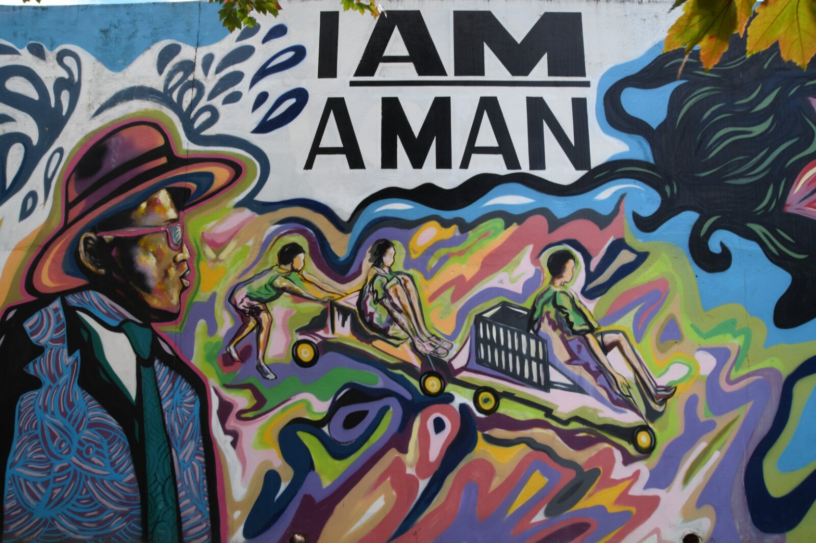 Detail of the I Am a Man civil rights panel, Pittman Park mural by Atlanta mural painter Corey Barksdale, with children at play