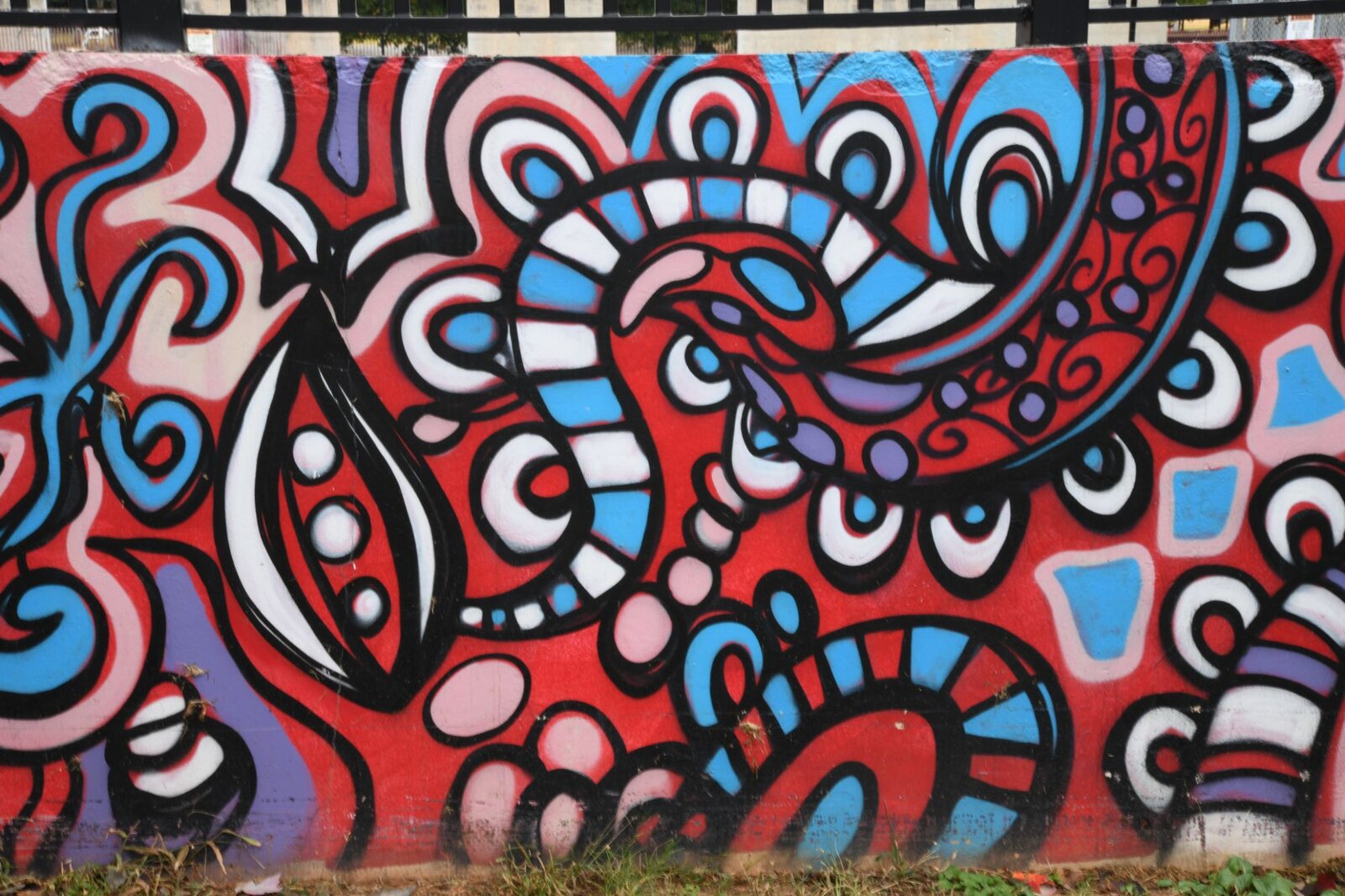 Abstract red and blue pattern panel, Pittman Park mural by Atlanta muralist Corey Barksdale
