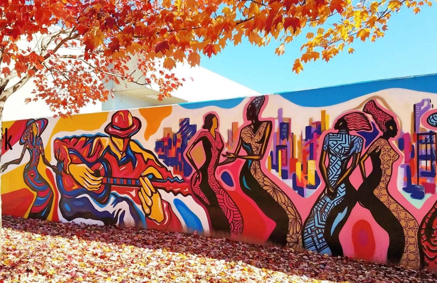 Wide view of the guitarist and dancers panel of the Pittman Park mural near Turner Field, by Atlanta mural painter Corey Barksdale